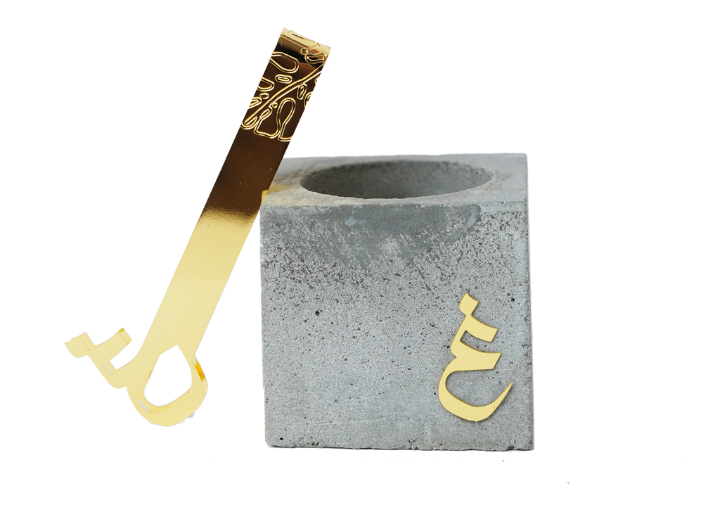 Concrete letter mubkhar and coal forceps